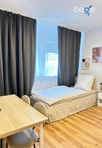 Postel nebo postele na pokoji v ubytování BEGE APARTMENTS ProTeam Base