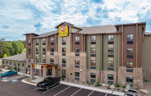 a rendering of a hotel with a for sale sign at My Place Hotel-Grand Rapids, MN in Grand Rapids