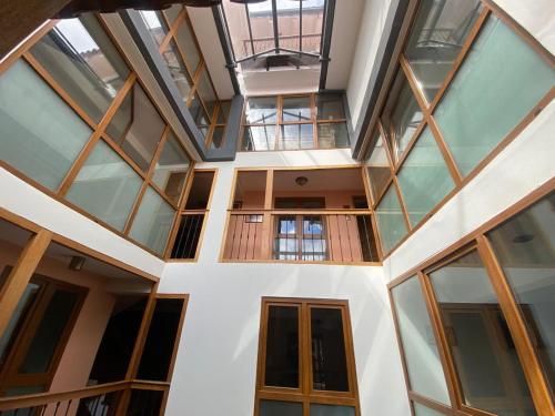 an interior view of a building with glass windows at Artinka Boutique Hotel in Cusco