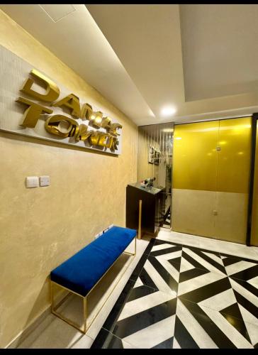 a lobby with a blue bench in a room at Amman damac tower عبدلي عمان دماك Abdali Boulevard in Amman