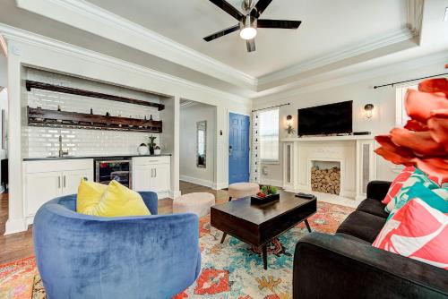 a living room with a blue couch and a table at Gatewood Getaway-City card 4 local biz discounts in Oklahoma City