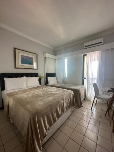 Postel nebo postele na pokoji v ubytování Flats Hotel Costa Mar Recife by Flatbpaiva