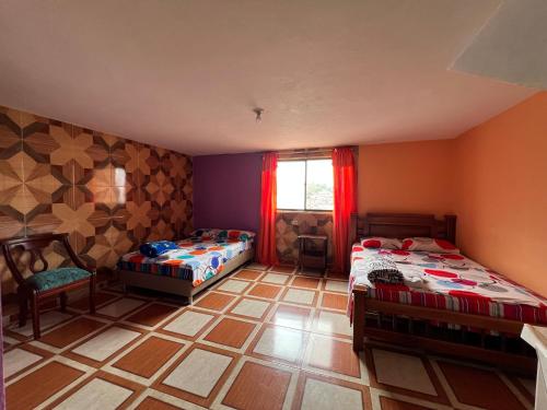 Postel nebo postele na pokoji v ubytování Hotel del Parque Támesis