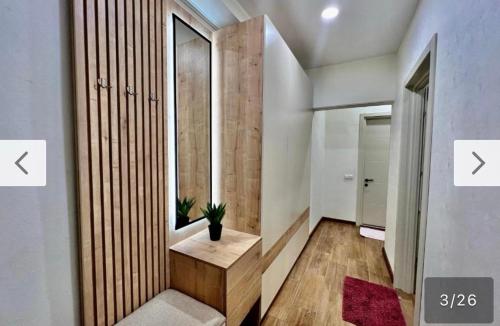 a small hallway with a bench in a room at Cozy Apartment Near Holiday Inn in Tbilisi City