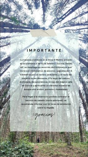 a sign in the middle of a forest at Reserva Santa Lucia de Salento in Salento