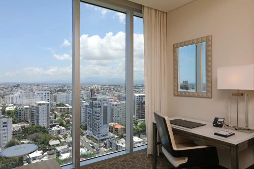an office with a desk with a view of a city at InterContinental Real Santo Domingo by IHG in Santo Domingo