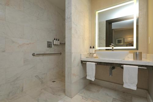 a bathroom with a sink and a mirror at InterContinental Real Santo Domingo by IHG in Santo Domingo