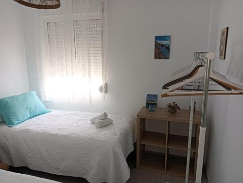 Ένα ή περισσότερα κρεβάτια σε δωμάτιο στο Duplex Avenida