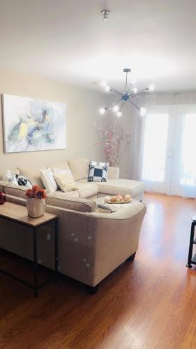 a living room with a couch and a table at The home away from home in Greensboro