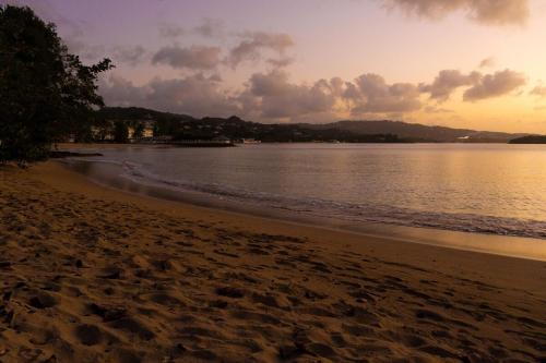 a view of the beach at sunset at Almond Tree Villa Beach Hideaway with Jacuzzi in Gros Islet