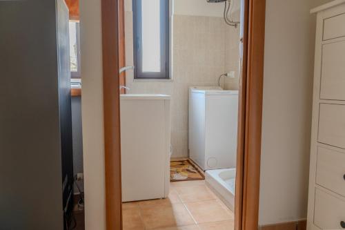 a bathroom with a toilet and a sink at Casa Vacanze Abete Bianco - Lorica in Cavaliere