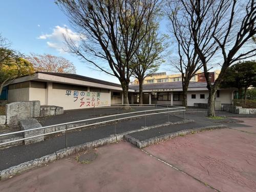 a building with graffiti on the side of it at VACATION INN HEIWAJIMA I in Tokyo