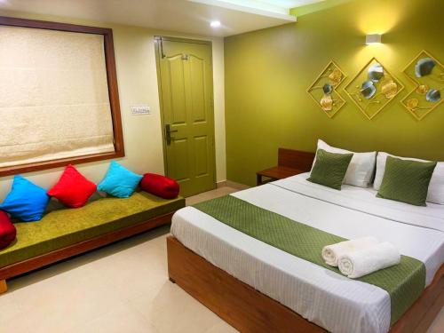 a bedroom with two beds and a window at Paradise Homestay in Alwaye