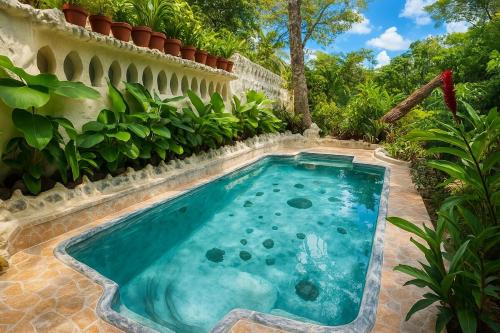 a swimming pool in the backyard of a house at Spacious room in Tagaytay! Pool, Billiards, Netflx in Tagaytay