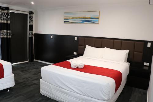 Postel nebo postele na pokoji v ubytování Krishna Motel - Newly Built in Papakura