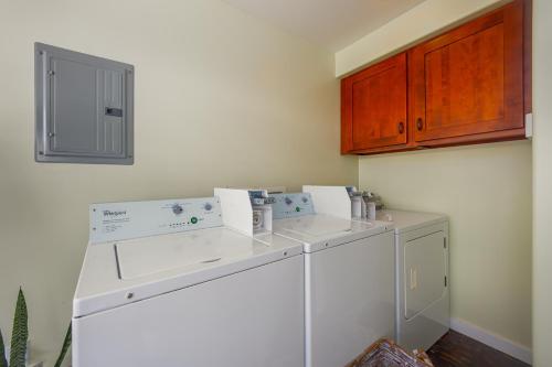 a laundry room with a washer and dryer at Kona Wave Rider - Island Sanctuary with Ocean Soul in Kailua-Kona