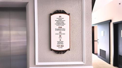 a menu sign on the wall of a building at Paxtonz Suite Kuala Lumpur in Petaling Jaya