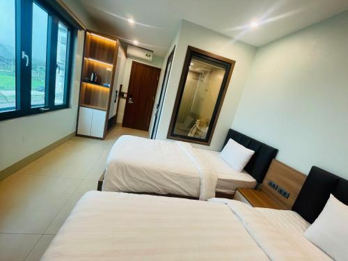 Ένα ή περισσότερα κρεβάτια σε δωμάτιο στο Tam Coc Guest House One & Hotel Ninh Binh