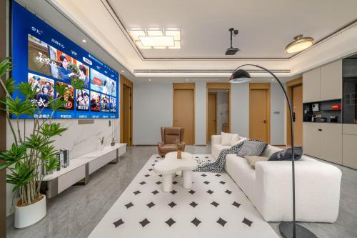 an office with a waiting room with a large screen at Dreamscape Retreat Three-bedroom suite near Atlantis Hotel Sanya in Sanya