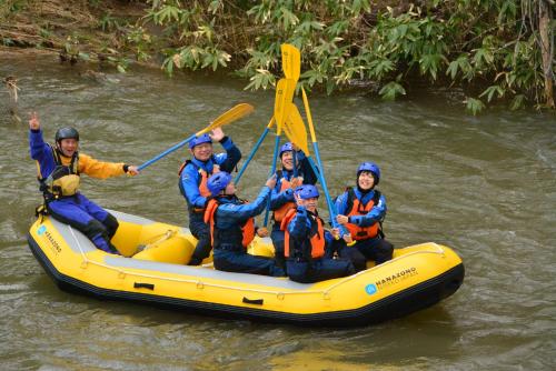 a group of people in a raft on a river at Forest Estate in Kutchan