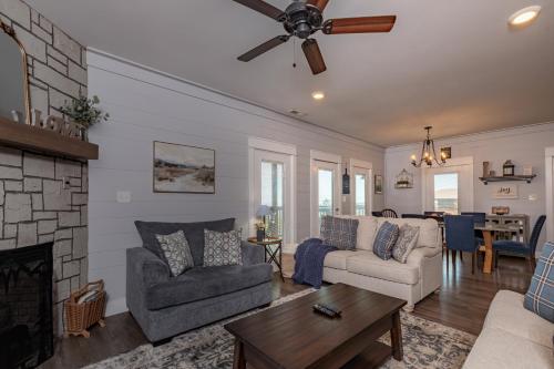 a living room with a couch and a fireplace at Red Roof Chalet of the Smokies in Gatlinburg