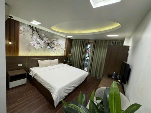 Postel nebo postele na pokoji v ubytování Hanoi Van Hoa Hotel