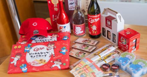 a table with a bottle of coca cola and some snacks at Hotel SEASONS NICHINAN in Nichinan