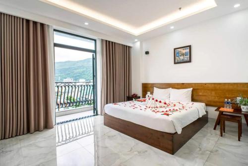 Postel nebo postele na pokoji v ubytování Hồng Gấm Hotel