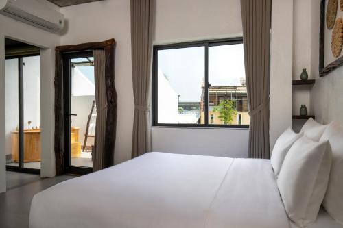 Katil atau katil-katil dalam bilik di Eco & Rustic Home Hoian