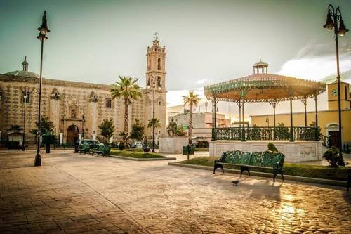 a large building with a gazebo in the middle of a courtyard at Mina la Prieta 2 Apartment in Hidalgo del Parral