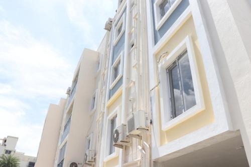a white building with white windows on it at Hotel Starlight Chennai near DLF,L&T,Miot,Tradecenter,Ramachandra medical coll in Chennai