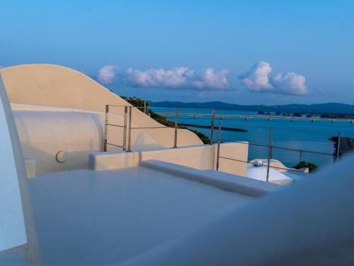 a view of the water from the balcony of a boat at Yuki Suite Kourijima in Nakijin