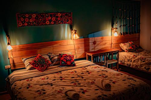 a bedroom with a bed with pillows on it at "CASITA AZUL"- Apartamento con bonita vista Volcan in Chivay