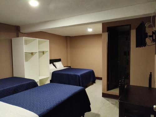 Postel nebo postele na pokoji v ubytování Hotel Fontana Real