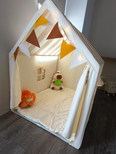a play tent with two stuffed animals sitting in it at Shan Hai Yun Jian in Wujie