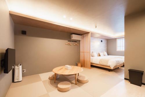 Una cama o camas en una habitación de BEPPU Risana