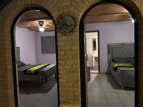 Giường trong phòng chung tại Casa-Hacienda Linda Vista