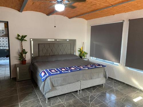 Giường trong phòng chung tại Casa-Hacienda Linda Vista