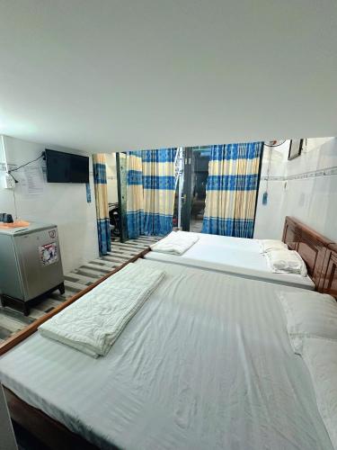 Letto o letti in una camera di Khách sạn Lý Phú Quý