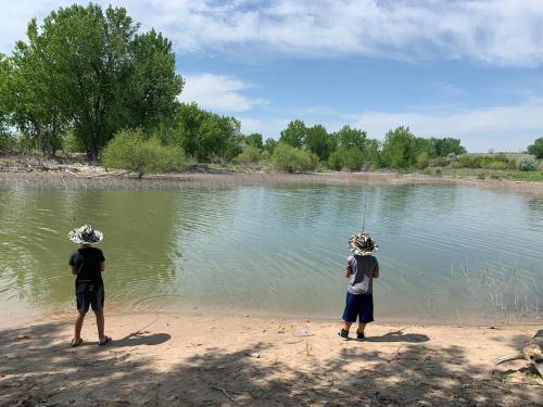 two people standing on the shore of a body of water at Lakeside Paradise! in Brule