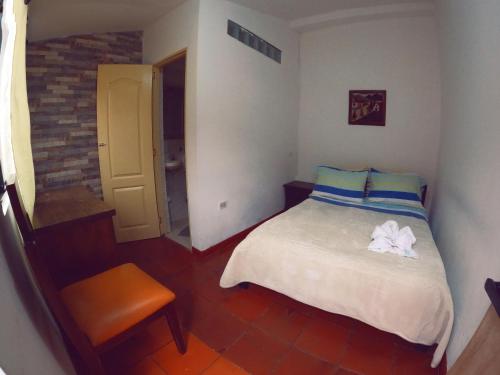 Postel nebo postele na pokoji v ubytování Ulucaho Hostel