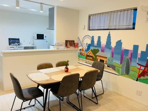 a dining room with a table and chairs at A newly built house a 4 minute walk from the station, Free parking & Let's enjoy the night view together! in Tokyo
