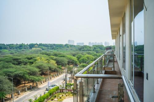a balcony of a building with a view of a street at Eternal Oasis by Alaya Stays, Golf Course Road in Gurgaon