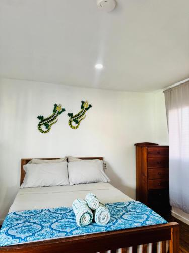 Ένα ή περισσότερα κρεβάτια σε δωμάτιο στο Go Slow Hostel