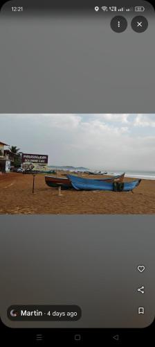 a picture of two boats on the beach at Srujana Beach Homestay in Gokarn