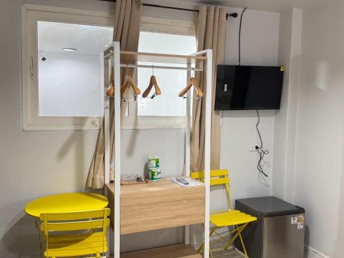 TV a/nebo společenská místnost v ubytování Miley Guesthouse