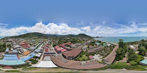 an aerial view of a city with buildings and the ocean at Bonny Hotel 4 Floors No Elevator in Lamai