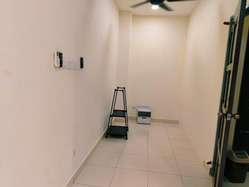a room with a ladder and a white wall at Senai three storey landed 14pax 5BR near airport in Kampung Seelung