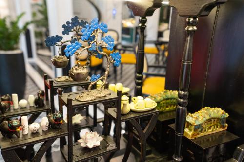 a table with desserts and other items on it at Yzistel Hoi An in Hoi An
