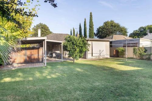 a house with a yard with a fence at Just the Spot in Myrtleford